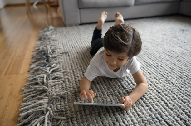 Girl laying rug | Key Carpet Corporation